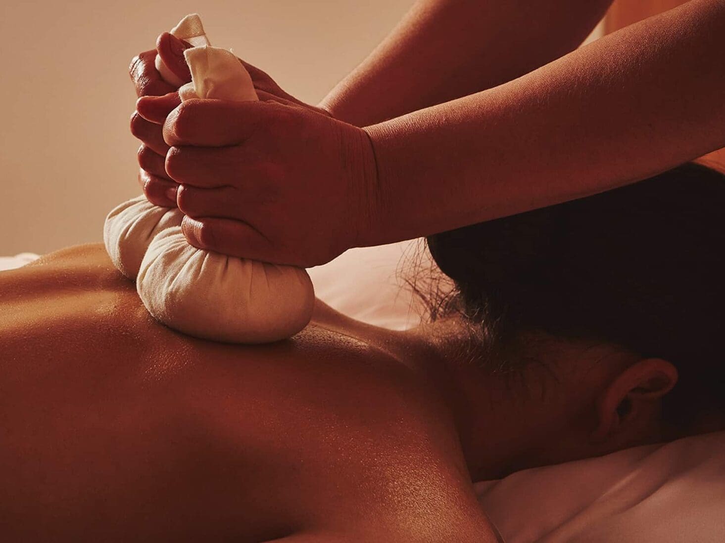 A model having a massage at Claridge's Spa, using Claridge's Spa home made poultices