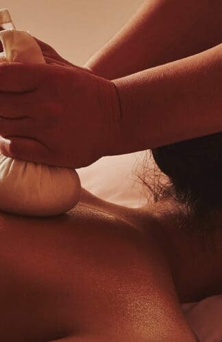 A model having a massage at Claridge's Spa, using Claridge's Spa home made poultices