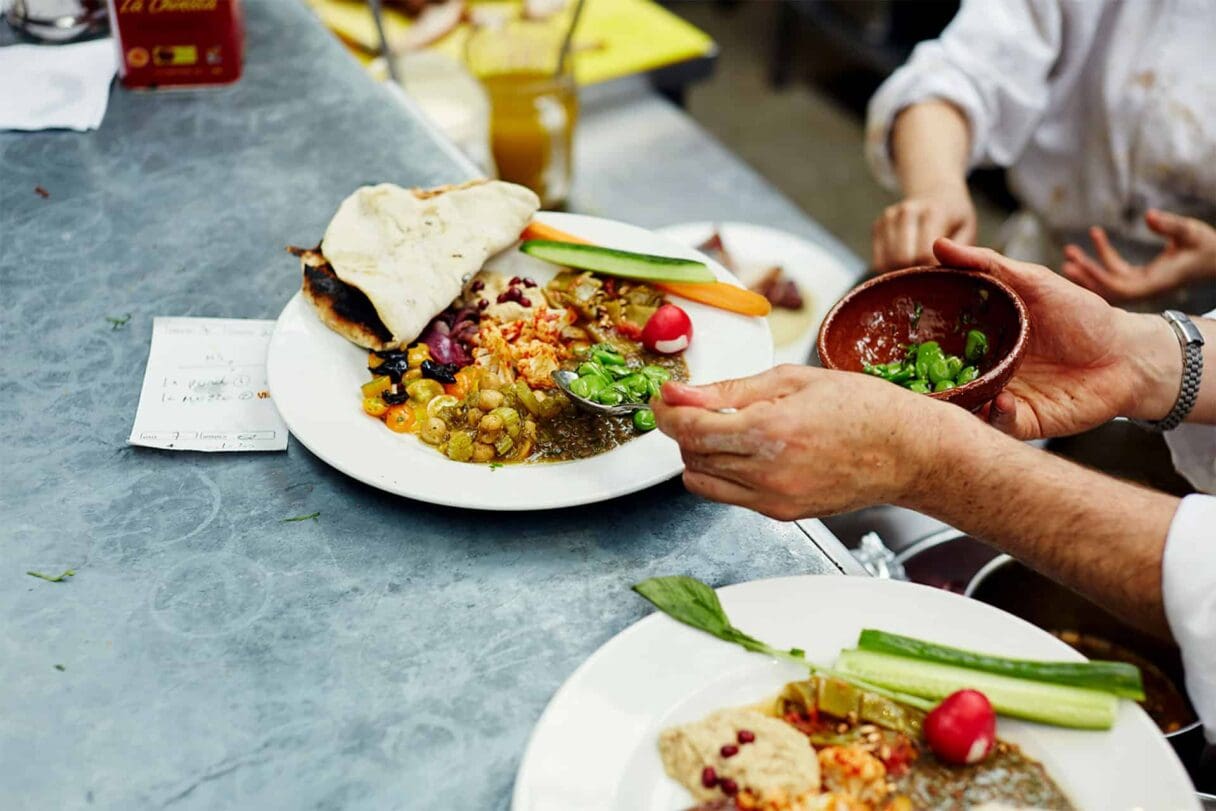Moro restaurant, Islington - plates being finished on kitchen pass
