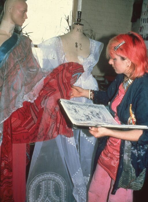 Zandra Rhodes working in her design studio, 1985. Image: Robyn Beeche.